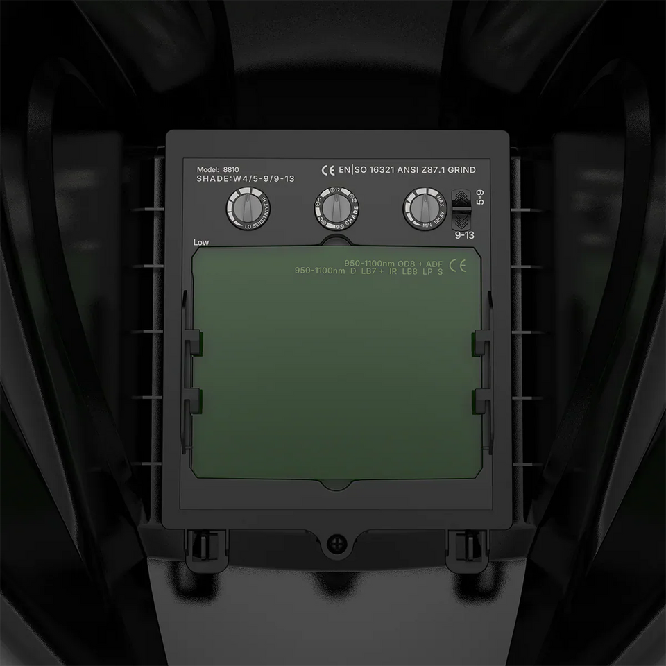 Auto-dimming laser helmet visor