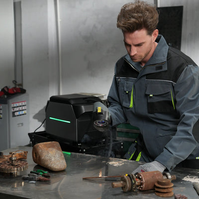 Workers are removing rust from the metal