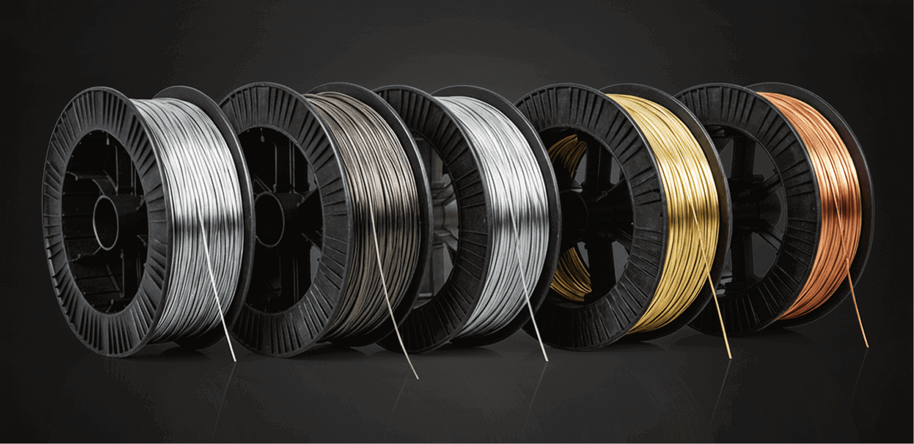 Different material coils for the wire feeder, including stainless steel, carbon steel, brass, and copper